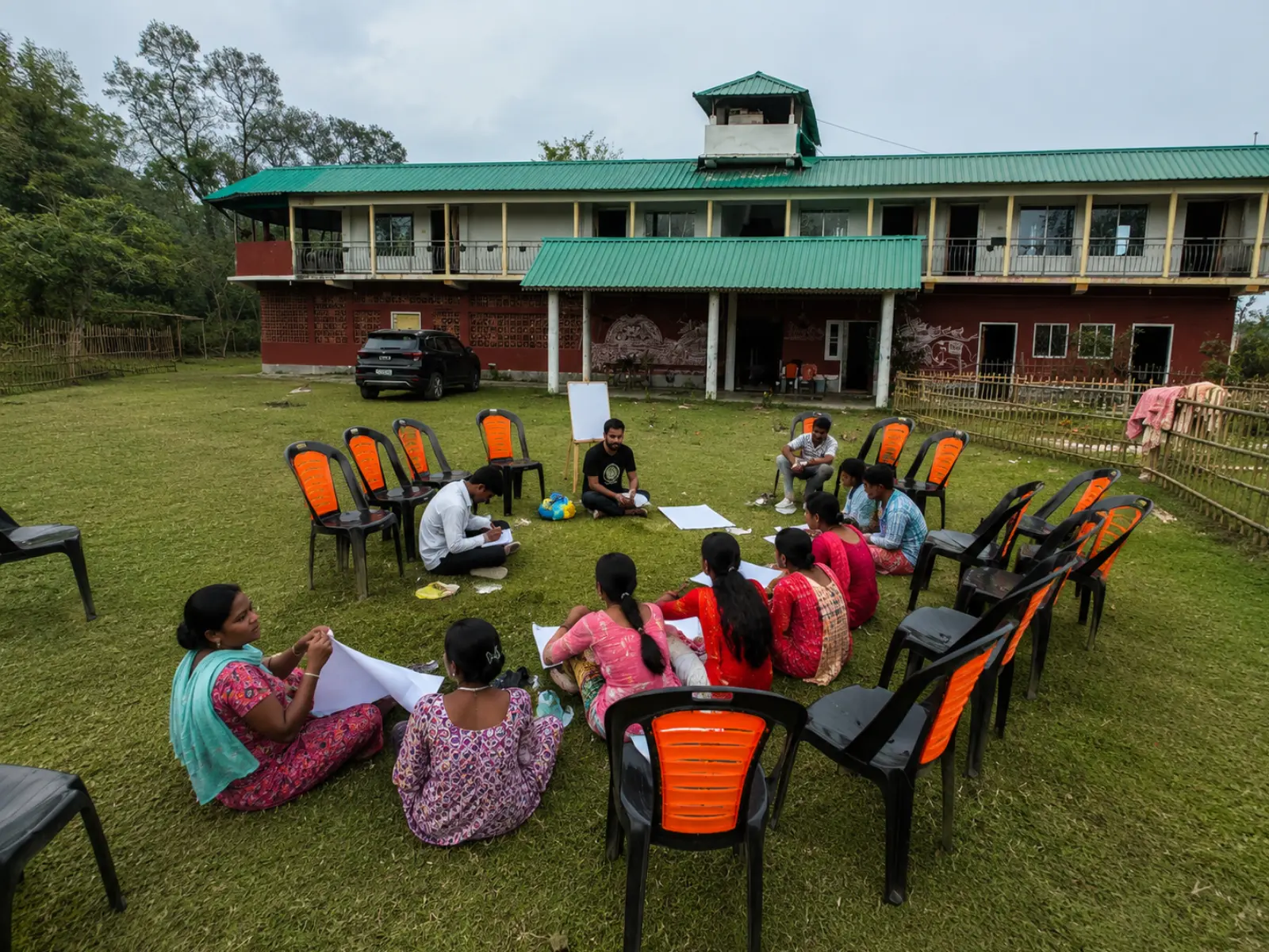 A residential camp group at work in the village