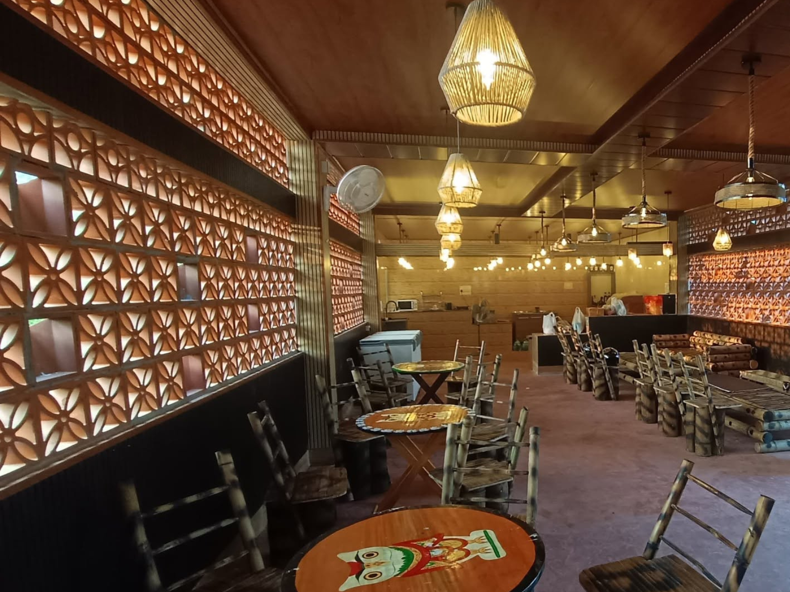 The art and craft room with bamboo furniture, hand-painted tables and terracotta lattice screens