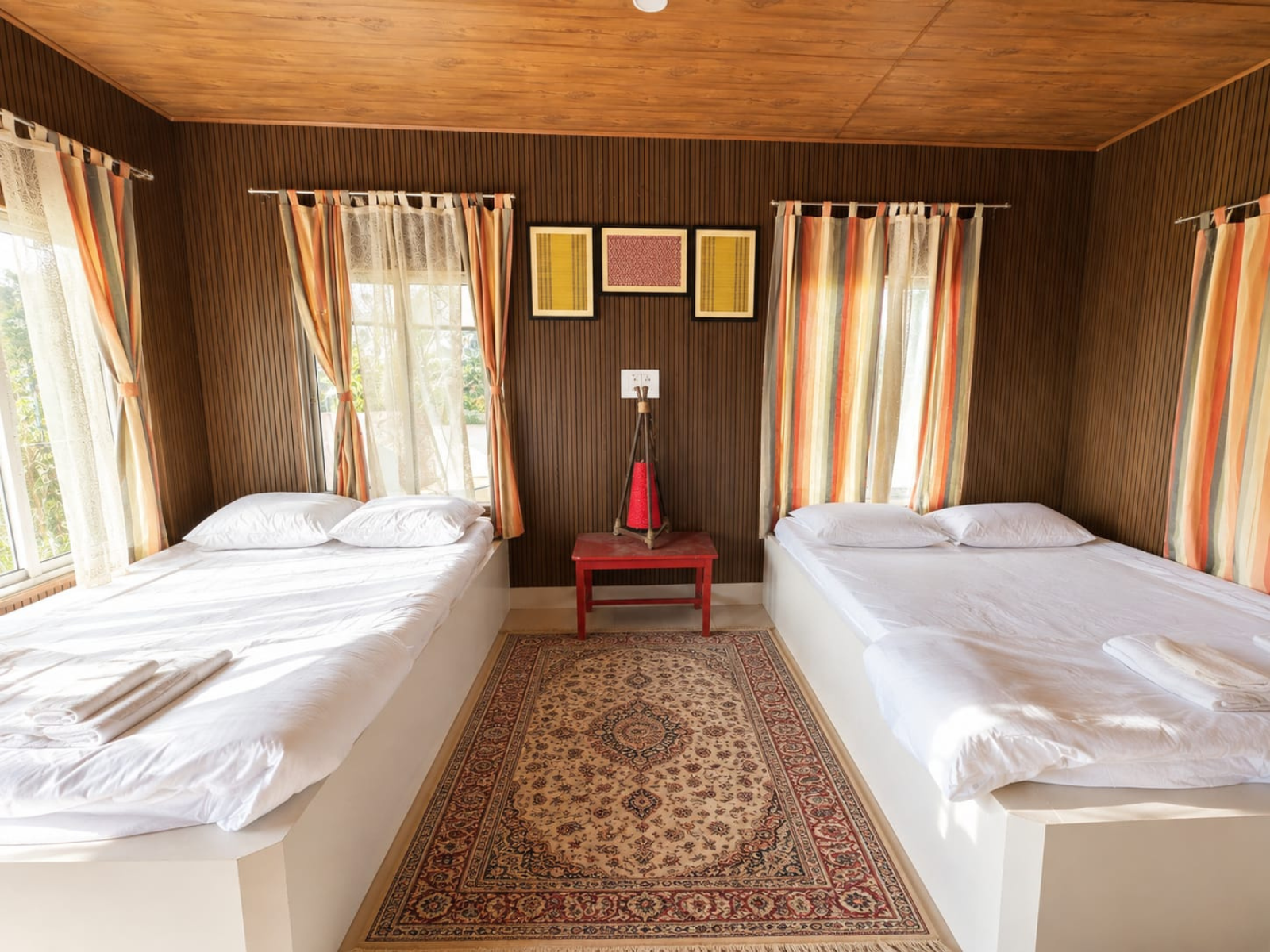 Two king size beds facing the windows in the Super Deluxe Room